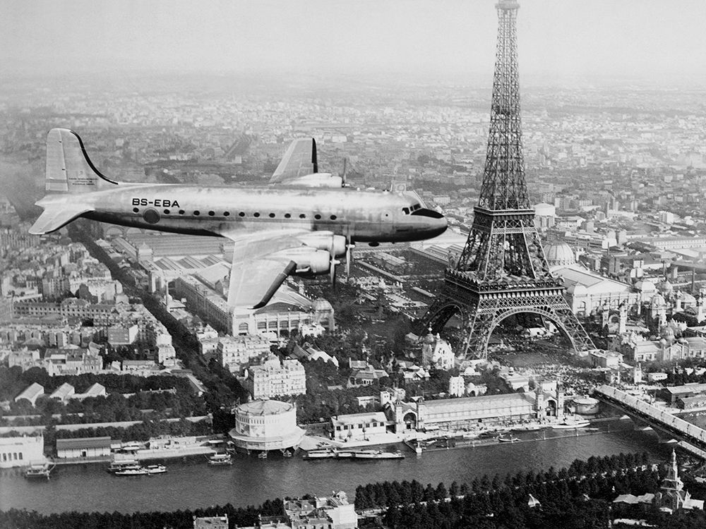 Airplane over Paris art print by Anonymous for $57.95 CAD