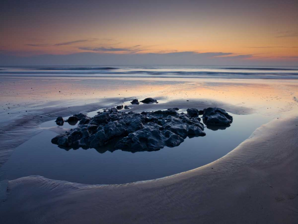 Rocks on the beach at dusk art print by Assaf Frank for $57.95 CAD