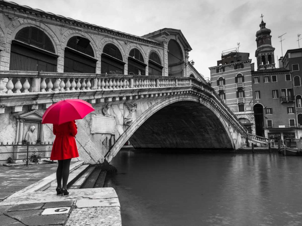 A woman in a red dress holding red umbrella and standing next to the Rialto bridge, Venice, Italy art print by Assaf Frank for $57.95 CAD