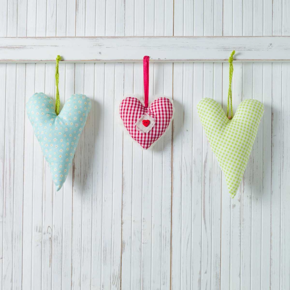 Hearts hanging on wooden background art print by Assaf Frank for $57.95 CAD