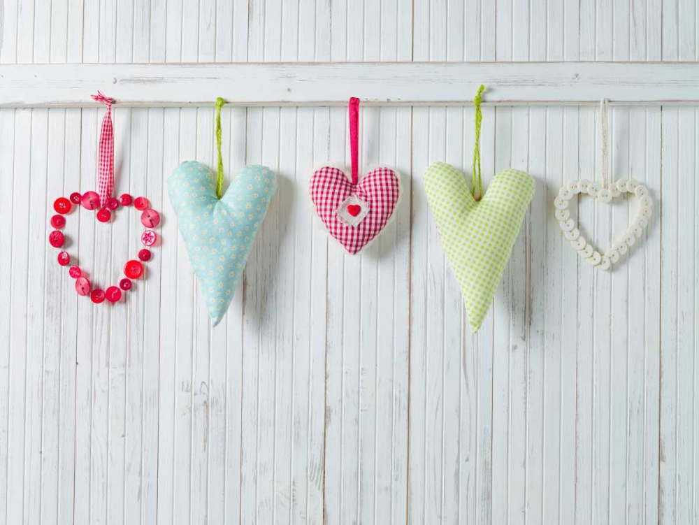 Hearts hanging on wooden background art print by Assaf Frank for $57.95 CAD