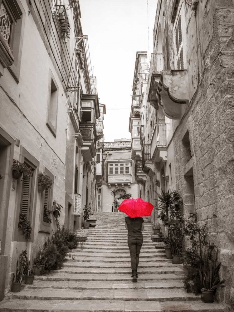 Tourist with umbrella in steps through houses in Birgu, Malta art print by Assaf Frank for $57.95 CAD