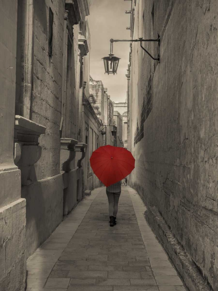 Tourist with heart shaped umbrella walking through narrow street of Mdina, Malta art print by Assaf Frank for $57.95 CAD