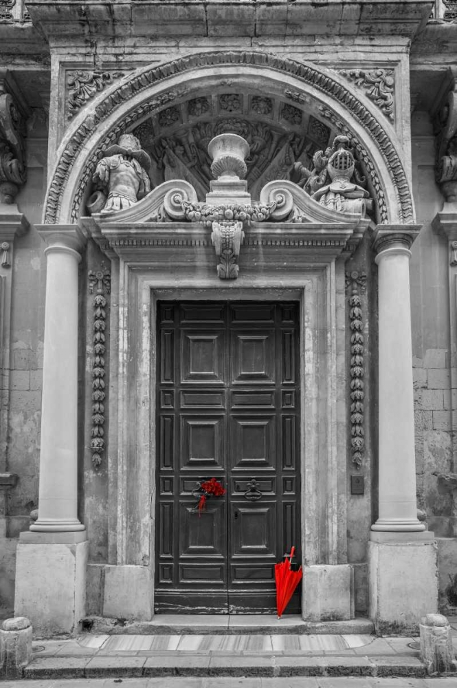 Bunch of roses with umbrella on door of a building in Mdina, Malta art print by Assaf Frank for $57.95 CAD