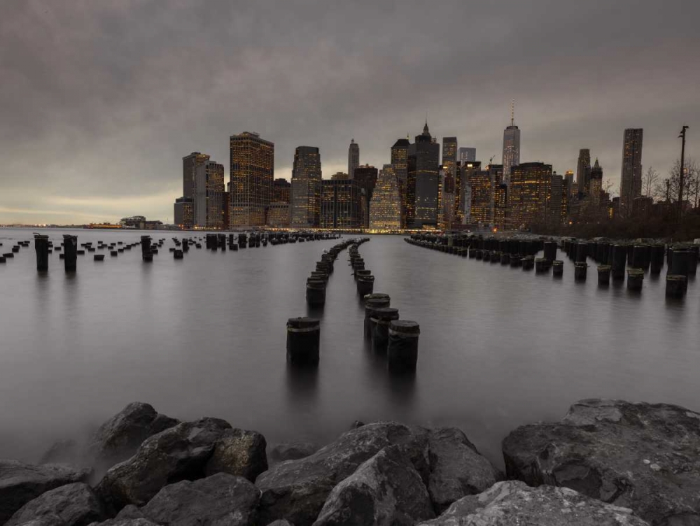 Manhattan skyline with rows of groynes in East river, New York art print by Assaf Frank for $57.95 CAD