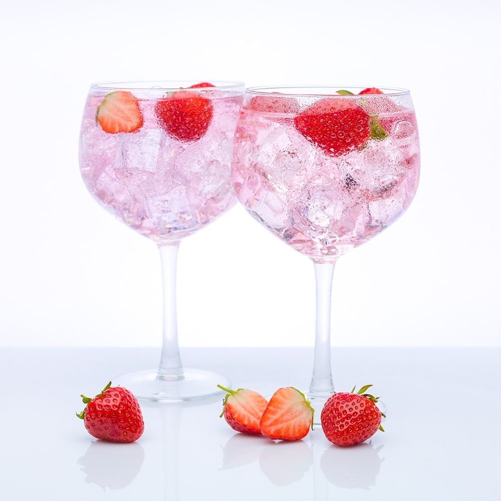 Gin with strawberries on white background art print by Assaf Frank for $57.95 CAD