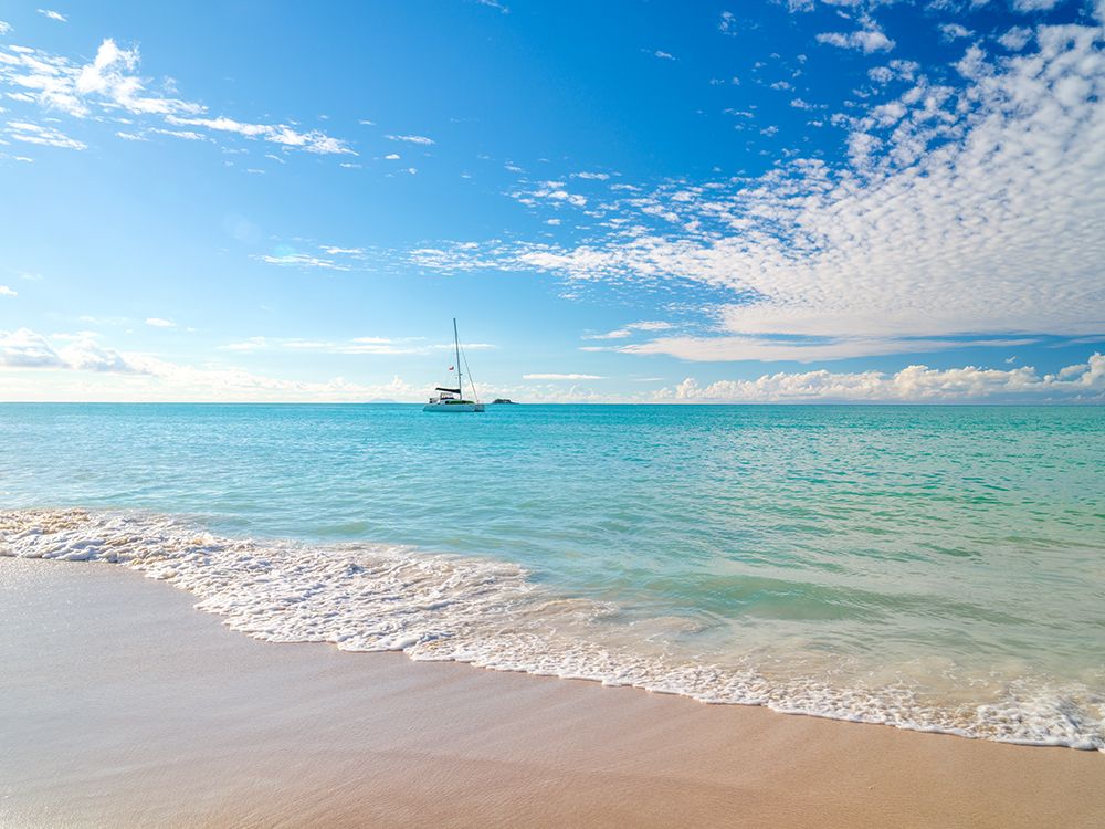 Seascape with a yacht sailing in the distance, Antigua art print by Assaf Frank for $57.95 CAD