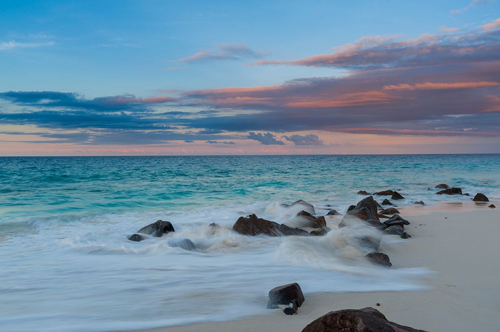 LIndian Ocean surf surging onto a rocky beach at sunset Anse Bambous Beach-Seychelles art print by Sergio Pitamitz for $57.95 CAD