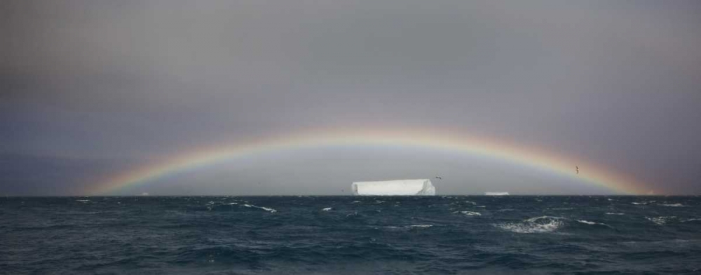 Antarctica, A tabular iceberg under a low rainbow art print by Don Grall for $57.95 CAD