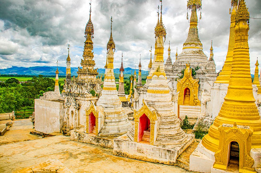 In Dein, Inle Lake, Myanmar. In Dein ruins, an ancient complex of pagodas and stupas in disrepair. art print by Murray McCallum for $57.95 CAD