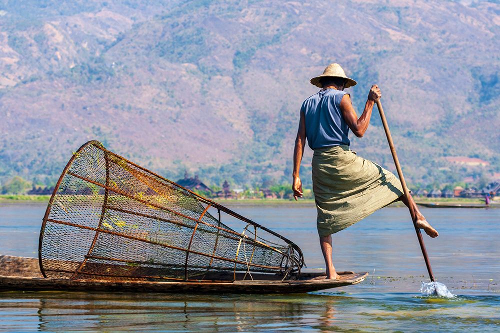 Inlay Lake-Shan State-Myanmar-Fisherman balances between his canoe and pole art print by Tom Haseltine for $57.95 CAD