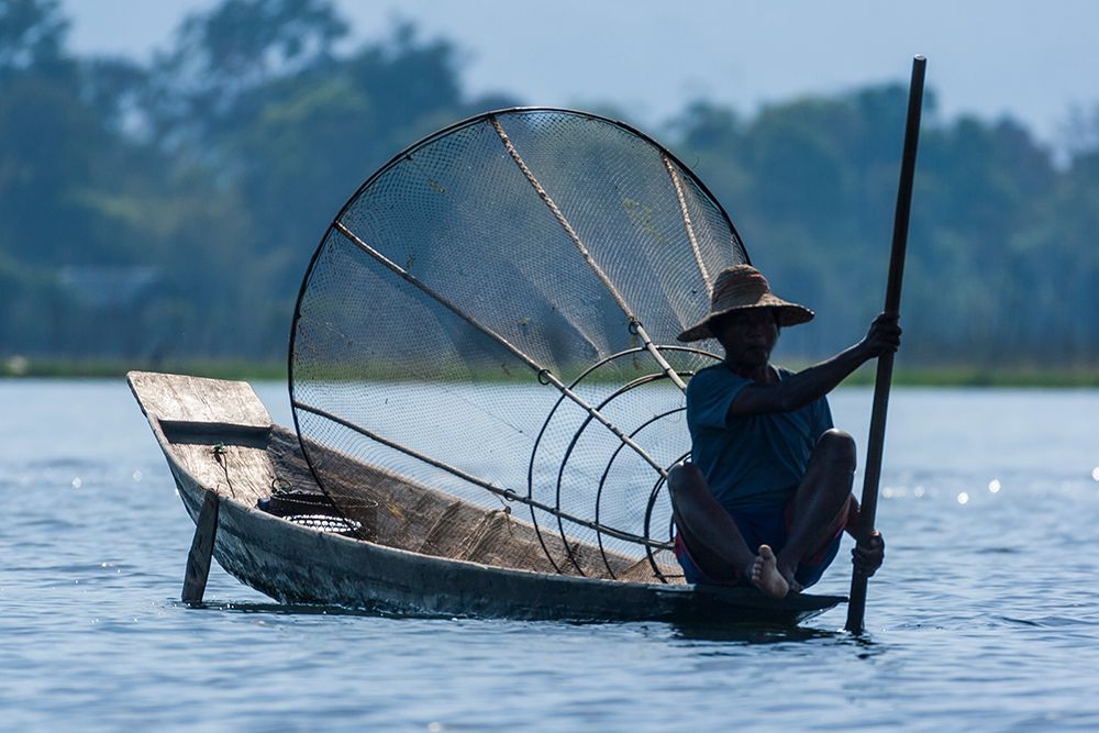 Inlay Lake-Shan State-Myanmar-Fisherman poles his canoe art print by Tom Haseltine for $57.95 CAD