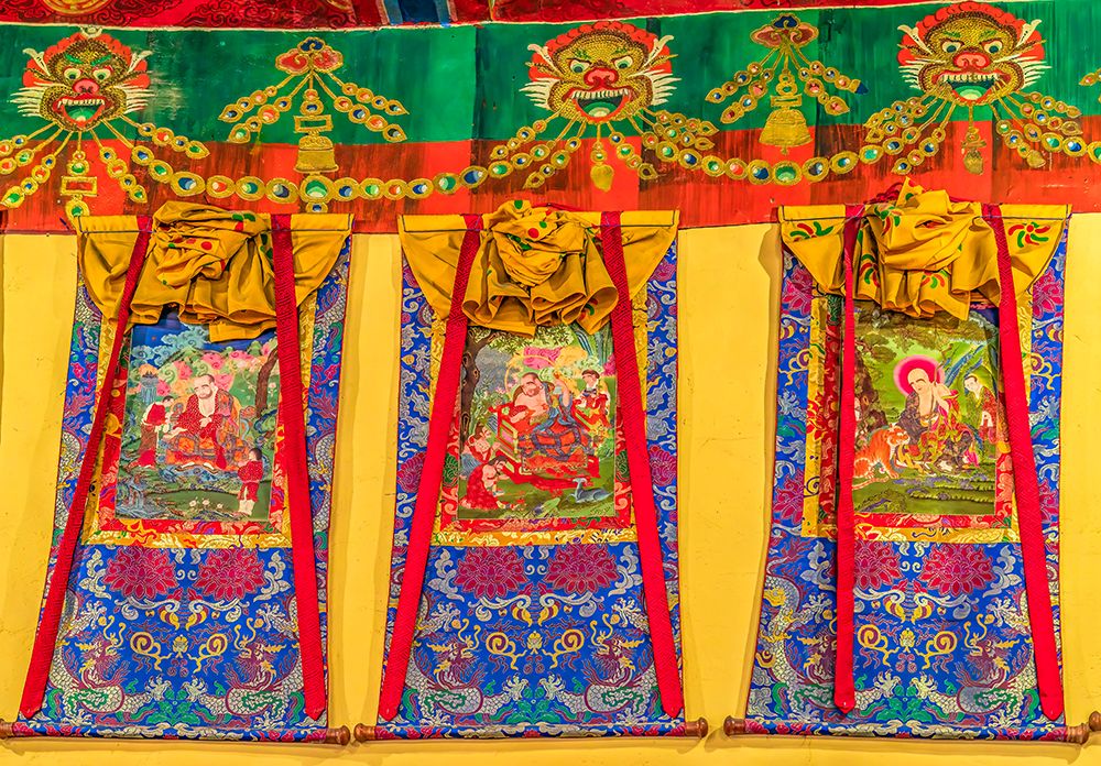 Diskit Monastery, Nubra Valley, Ladakh, India. 14th c. Tibetan Buddhist thangkas in prayer room. art print by Murray McCallum for $57.95 CAD