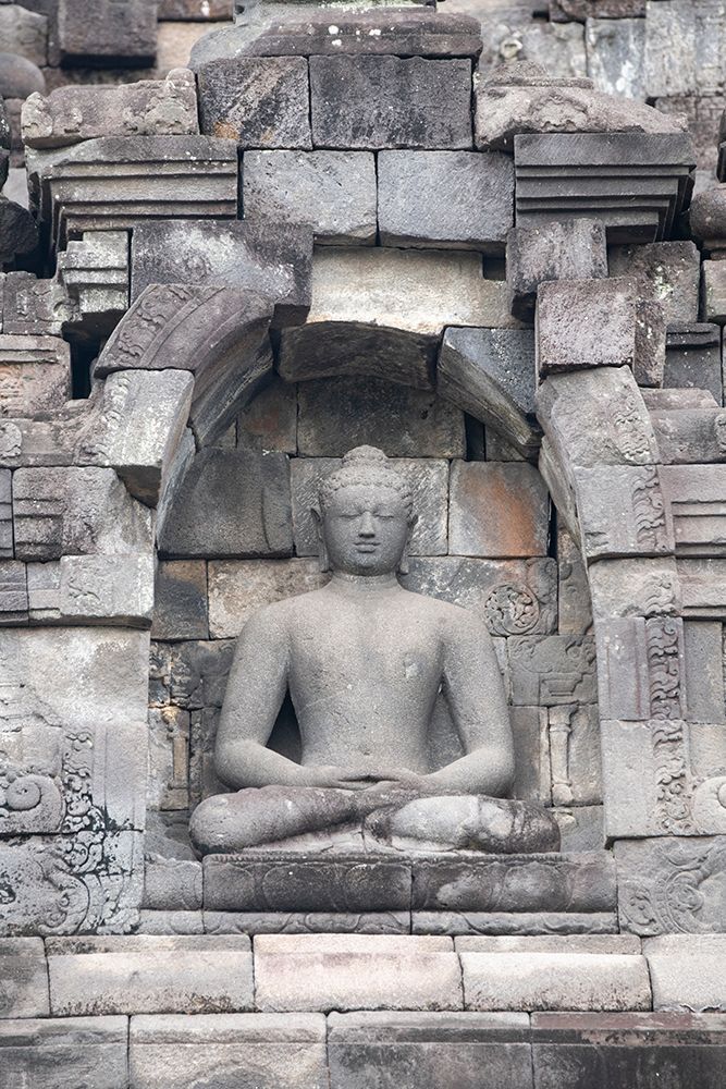 Indonesia-Java-Borobudur. Largest Buddhist monument in the world. Buddha statue in ornate wall. art print by Cindy Miller Hopkins for $57.95 CAD