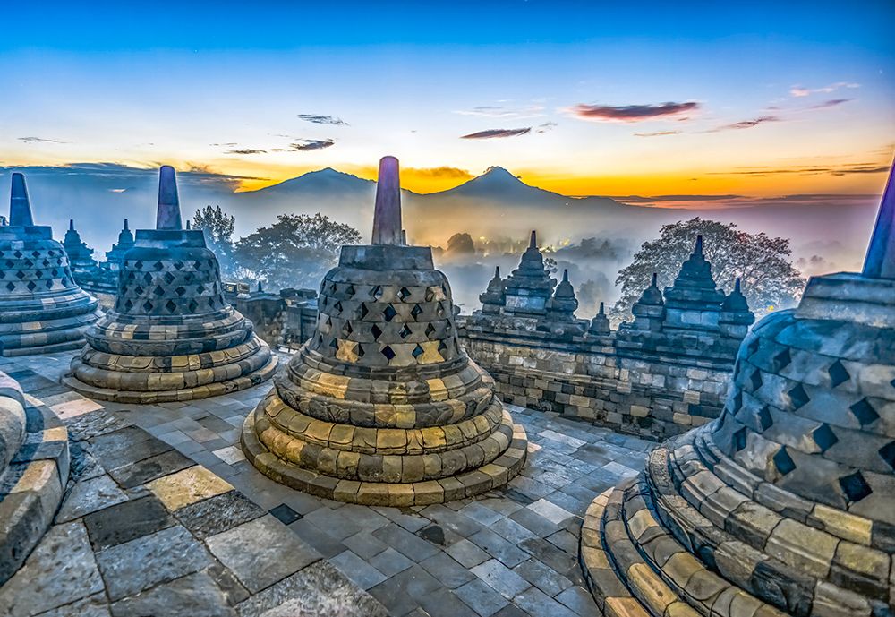 Java, Indonesia, Asia, Sunrise over Borobudur Temple, the largest Buddhist Temple in the world. art print by Murray McCallum for $57.95 CAD