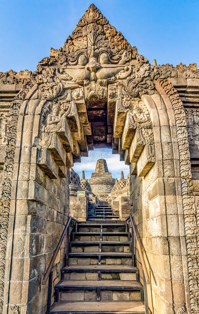 Borobudur Temple, Java, Indonesia.Carved stone archway leading up stairs in ancient Buddhist temple art print by Murray McCallum for $57.95 CAD