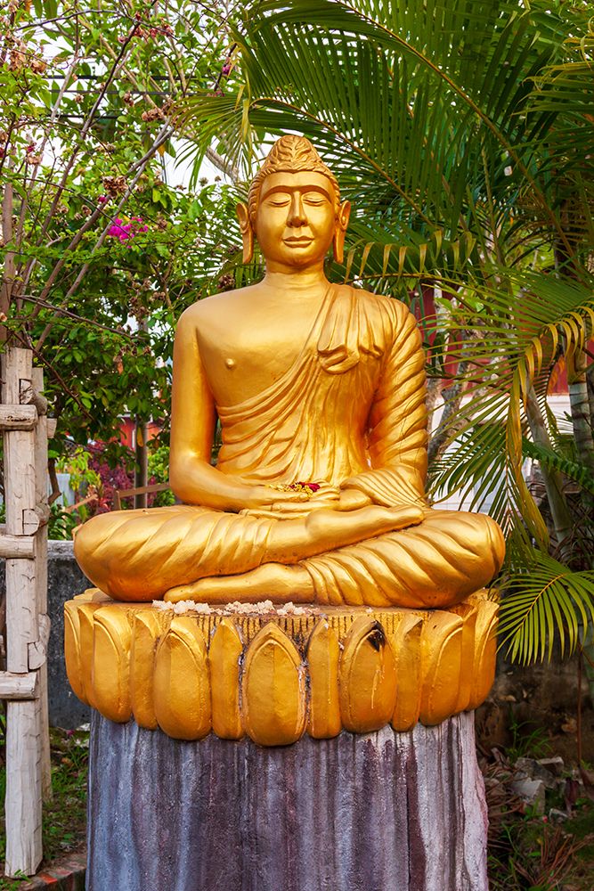 Laos- Luang Prabang. Golden Buddha statue with elongated earlobes. art print by Tom Haseltine for $57.95 CAD