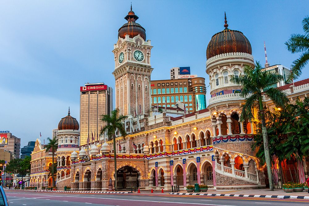 Kuala Lumpur- West Malaysia. Sultan Abdul Samad Building and its clock tower in Merdeka square. art print by Tom Haseltine for $57.95 CAD