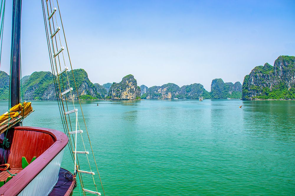 Ha Long Bay, Vietnam. hotel boat among limestone karsts and islets of the UNESCO Heritage Site. art print by Murray McCallum for $57.95 CAD