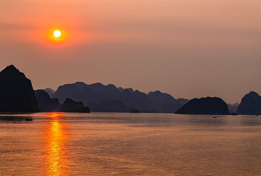 Ha Long Bay, Vietnam. fishing boats at sunset among the limestone karsts and islets. art print by Murray McCallum for $57.95 CAD