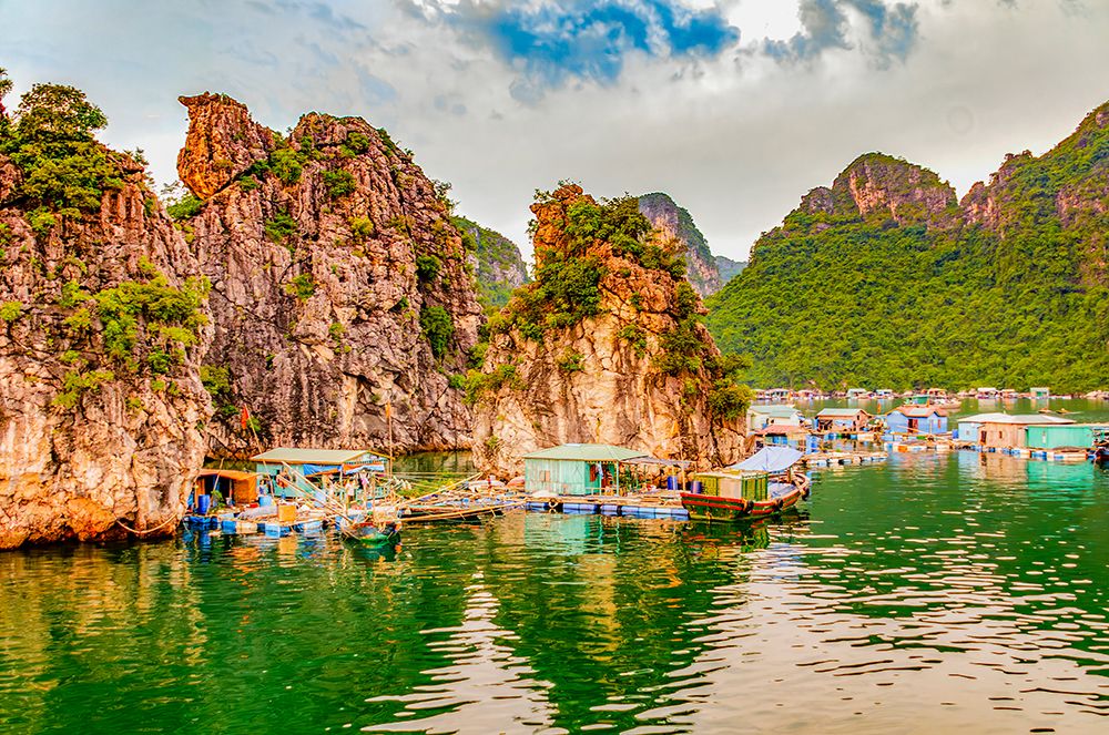 Ha Long Bay, Vietnam. Floating fishing village among limestone karsts and islets of UNESCO Site. art print by Murray McCallum for $57.95 CAD