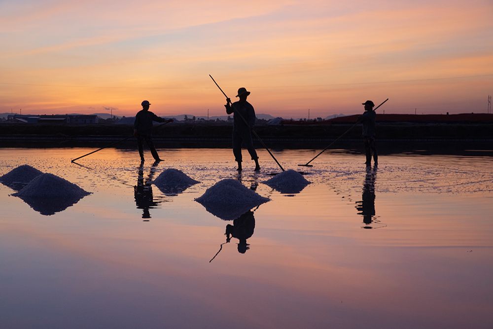 Vietnam-Doc Let Salt lake-Workers harvesting the salt-Early morning sunrise art print by Tom Norring for $57.95 CAD