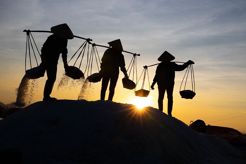 Vietnam-Doc Let Salt lake-Workers harvesting the salt-Early morning sunrise art print by Tom Norring for $57.95 CAD