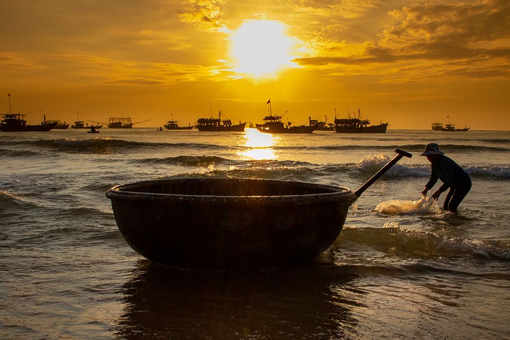 Vietnam-Fishermen deliver the nights catch to the beach at Hoi An art print by Tom Norring for $57.95 CAD