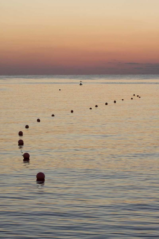 UAE, Fujairah Sunrise over marker buoys on beach art print by Bill Young for $57.95 CAD