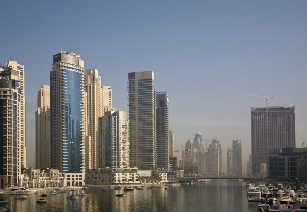 UAE, Dubai Marina towers with boats at anchor art print by Bill Young for $57.95 CAD