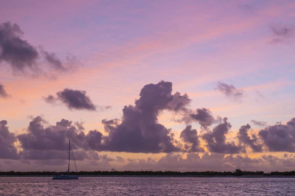 Bahamas, Exuma Is Sailboat anchored at sunset art print by Don Paulson for $57.95 CAD