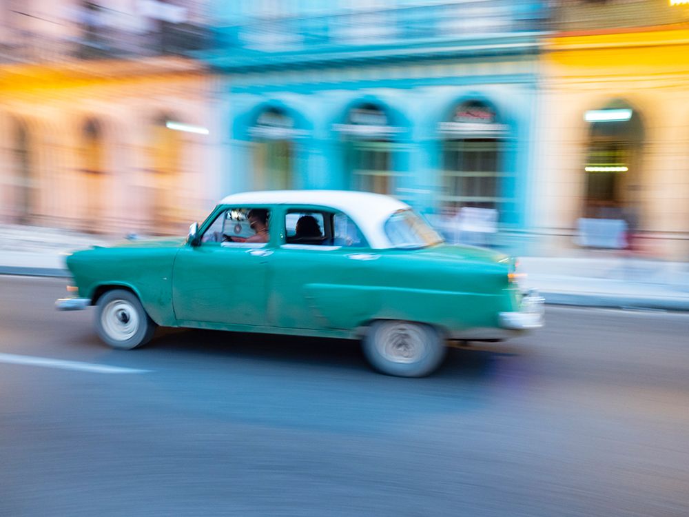 Cuba-Havana-Havana Vieja-UNESCO World Heritage Site-classic car in motion art print by Merrill Images for $57.95 CAD