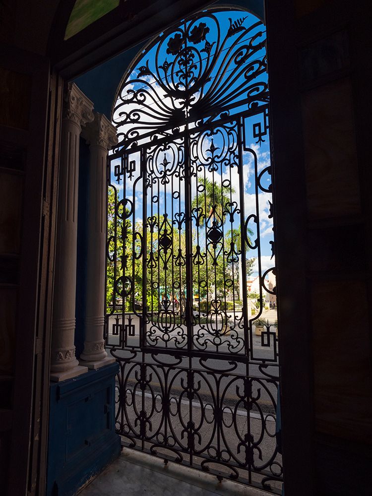 Cuba-Camaguey-UNESCO World Heritage Site-wrought iron grill in giant window of colonial mansion art print by Merrill Images for $57.95 CAD