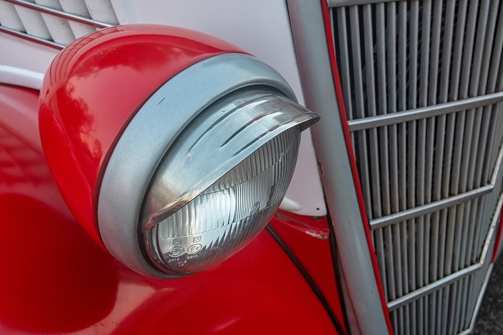 Detail of head light and grill on red classic American Ford in Habana-Havana-Cuba art print by Janis Miglavs for $57.95 CAD