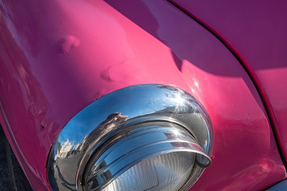 Detail of chrome head light on hot pink classic American Oldsmobile-Havana-Cuba art print by Janis Miglavs for $57.95 CAD