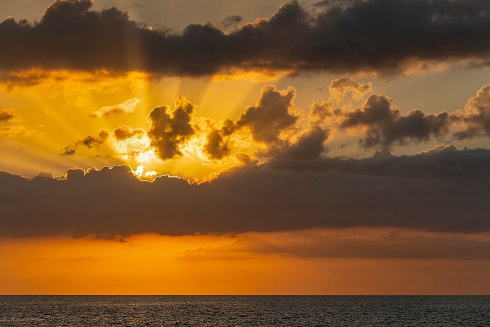 Sunset in clouds over ocean La Boca-Cuba art print by Janis Miglavs for $57.95 CAD