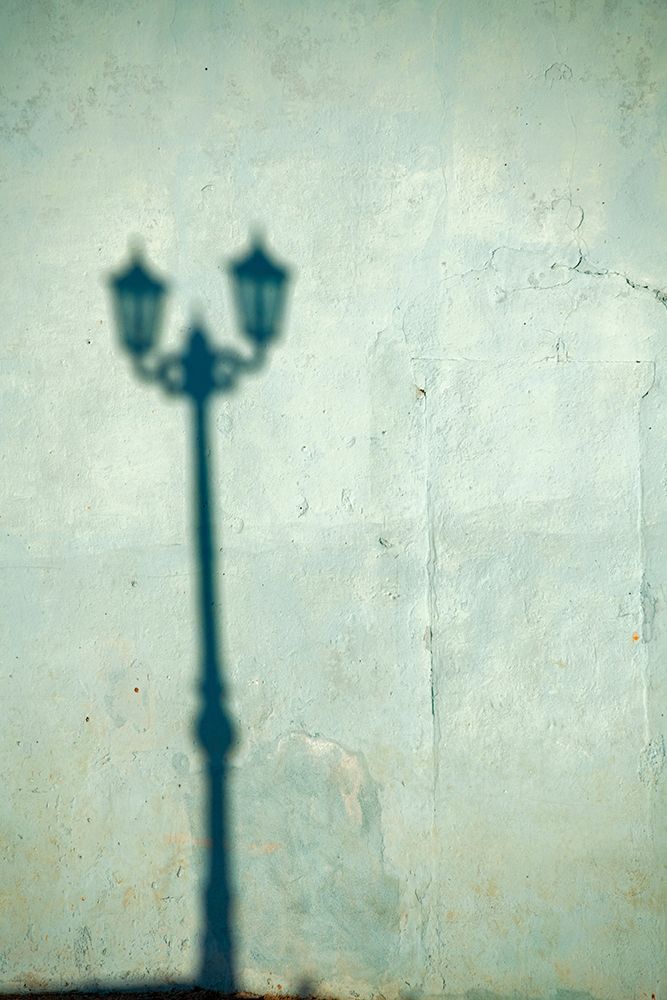 Morning shadow of a lamppost on light blue-green house wall in Trinidad-Cuba art print by Janis Miglavs for $57.95 CAD