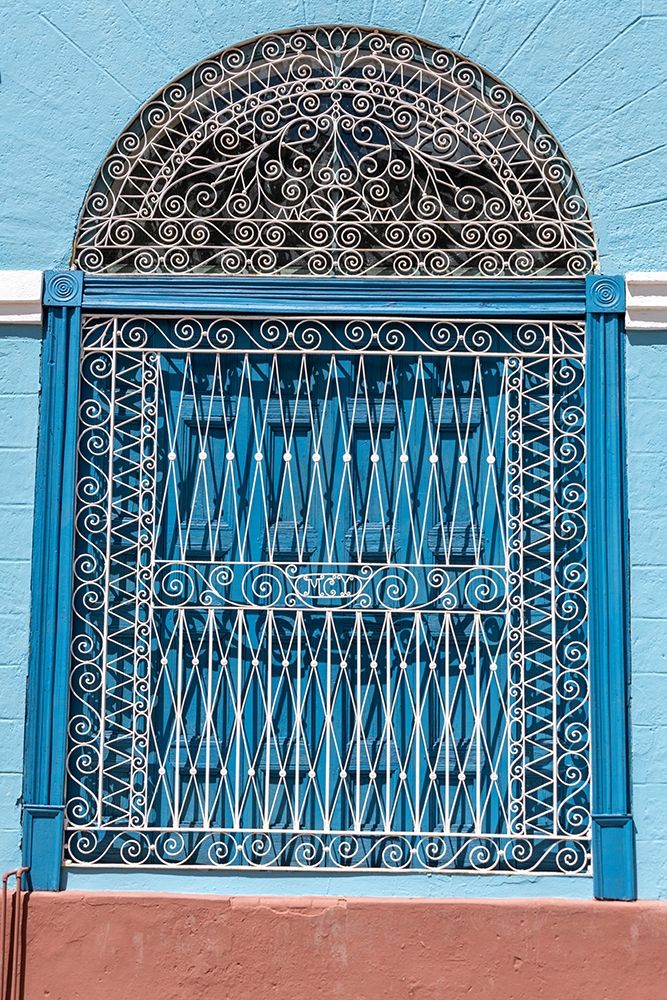 Ornate wrought iron covering on blue wooden window shutters-Trinidad-Cuba art print by Janis Miglavs for $57.95 CAD