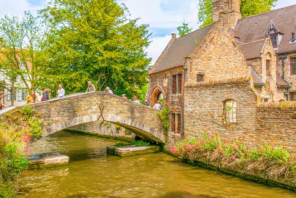Bruges, Belgium. Canal and medieval buildings which make it a famous UNESCO tourist attraction. art print by Murray McCallum for $57.95 CAD