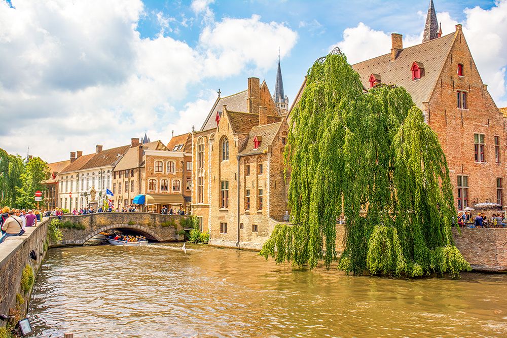 Bruges, Belgium. City known for its canals, cobbled streets and medieval buildings. art print by Murray McCallum for $57.95 CAD