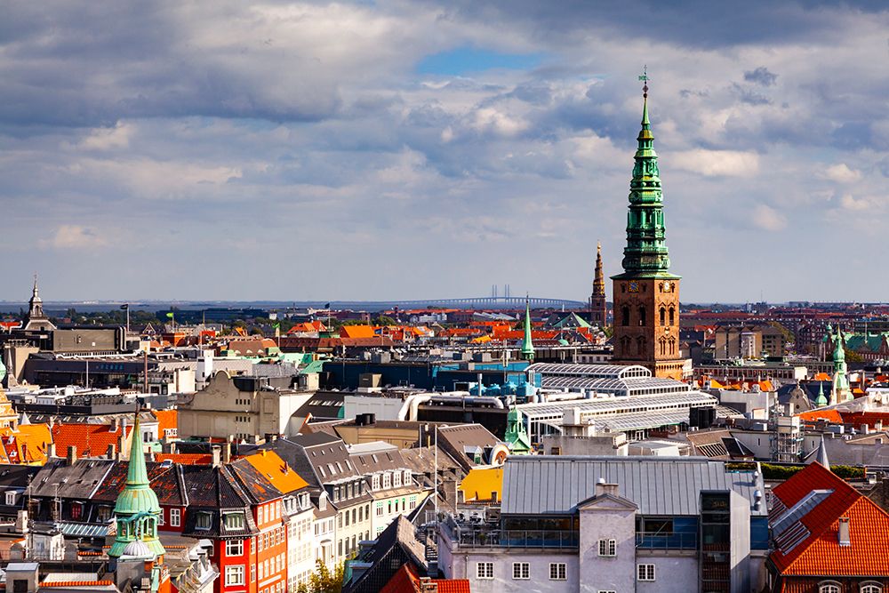 Christiansborg Palace tower and NASDAQ Copenhagen. Oresund Bridge in distance, Copenhagen, Denmark. art print by Rob Casey for $57.95 CAD
