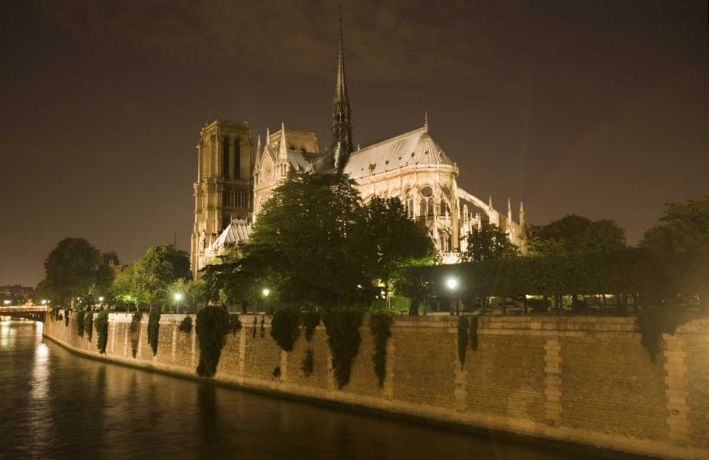 France, Paris Notre Dame Cathedral lit at night art print by Jim Zuckerman for $57.95 CAD
