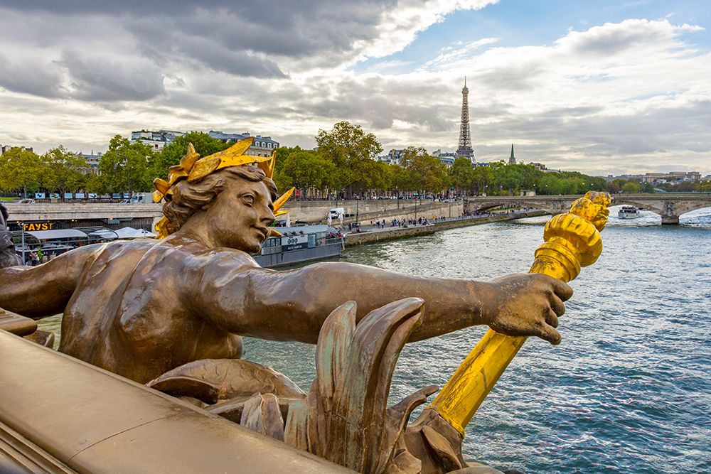 Paris. Nymphes de la Seine statue on Pont Alexandre III- along River Seine. Distant Eiffel Tower. art print by Emily Wilson for $57.95 CAD