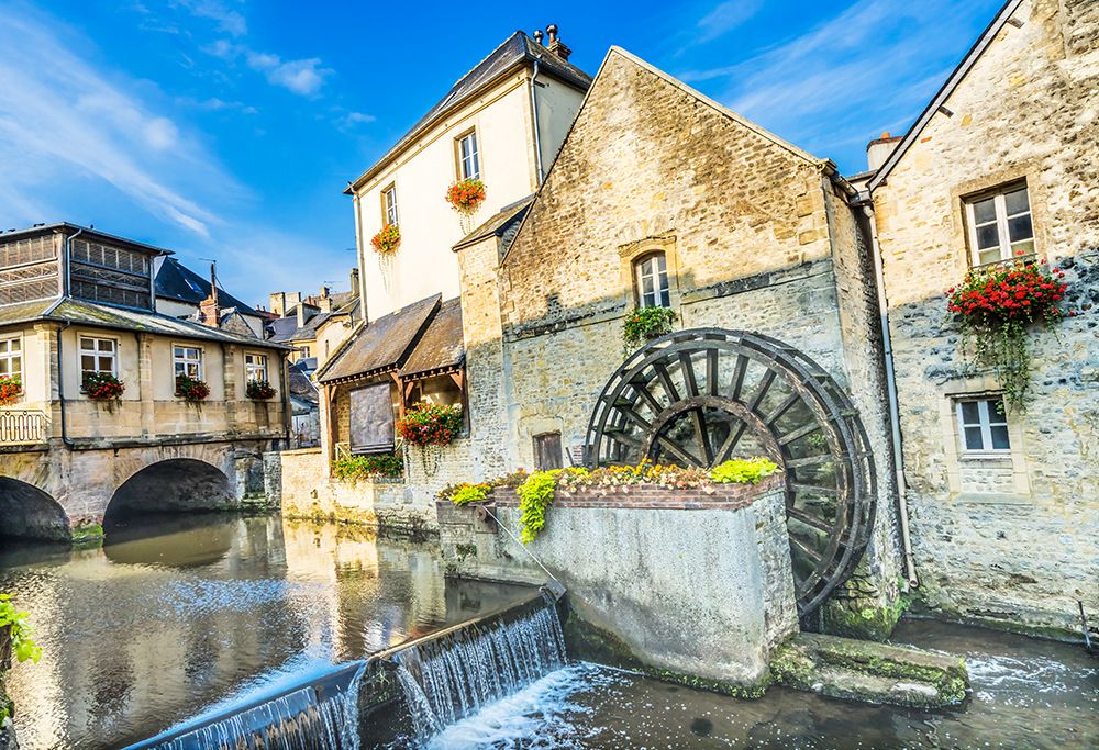 Colorful old buildings- Aure River reflection- Bayeux- Normandy- France art print by William Perry for $57.95 CAD