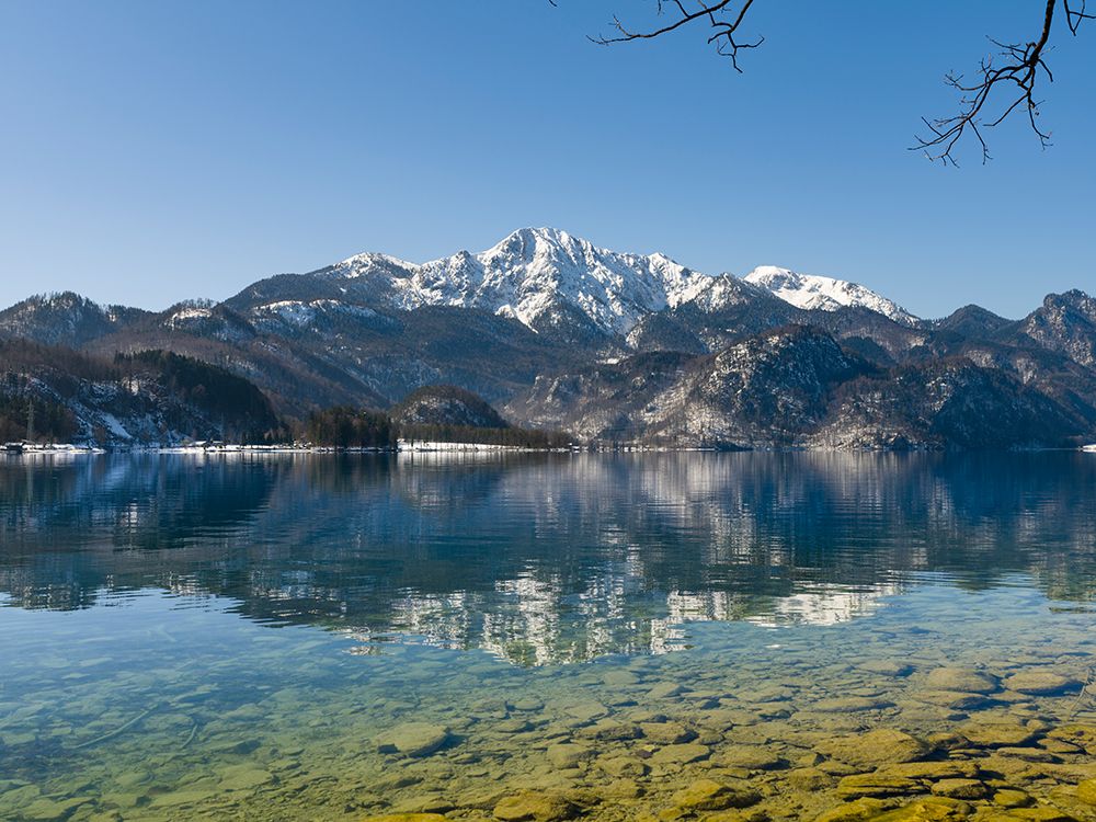 Lake Kochelsee at village Kochel am See during winter in the Bavarian Alps-Mt-Herzogstand in the ba art print by Martin Zwick for $57.95 CAD
