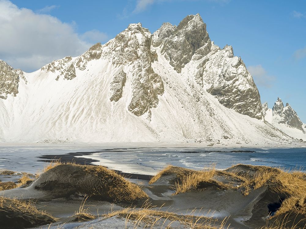 Coastal landscape with dunes at iconic Stokksnes during winter and stormy conditions Iceland art print by Martin Zwick for $57.95 CAD
