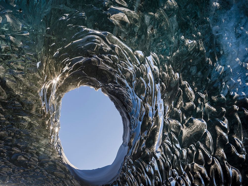 Ice cave at the northern shore of glacial lagoon Jokulsarlon in glacier Breidamerkurjokull art print by Martin Zwick for $57.95 CAD