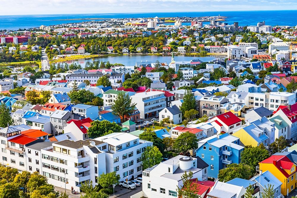 Small Tjornin Lake blue Ocean Sea Colorful blue red white green Houses Streets-Reykjavik-Iceland art print by William Perry for $57.95 CAD