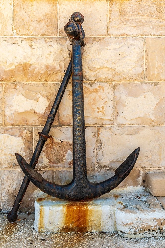Italy-Apulia-Metropolitan City of Bari-Giovinazzo Old rusted anchor in front of a stone wall art print by Emily Wilson for $57.95 CAD
