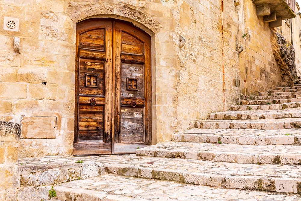 Italy-Basilicata-Province of Matera-Matera Old wooden door in a stone wall above stone steps art print by Emily Wilson for $57.95 CAD